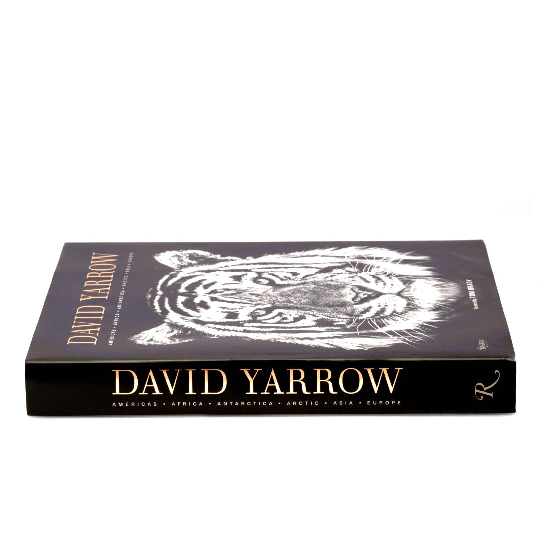 David Yarrow Photography-Americas Africa Antarctica Arctic Asia Europe - by David Yarrow, Foreword by Tom Brady, Published by Rizzoli-Black, White, and Metallic Gold Side Spine Flat and Front Cover With Dust Jacket