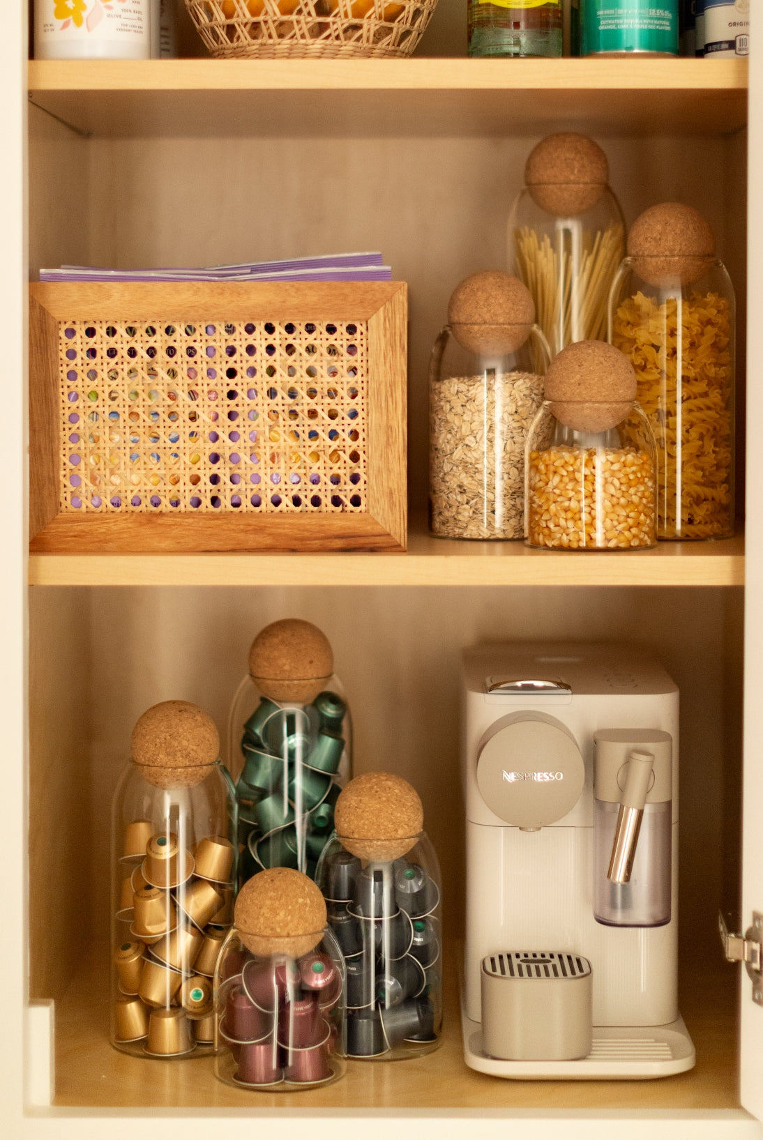 Sienna Maison Madison Cork Ball Dishwasher-Safe Borosilicate Glass Canisters Set of 4 sizes styled display in kitchen counter cupboard or pantry shelf organization of grains and coffee pods with Milo Acacia Rattan Storage Bin Box