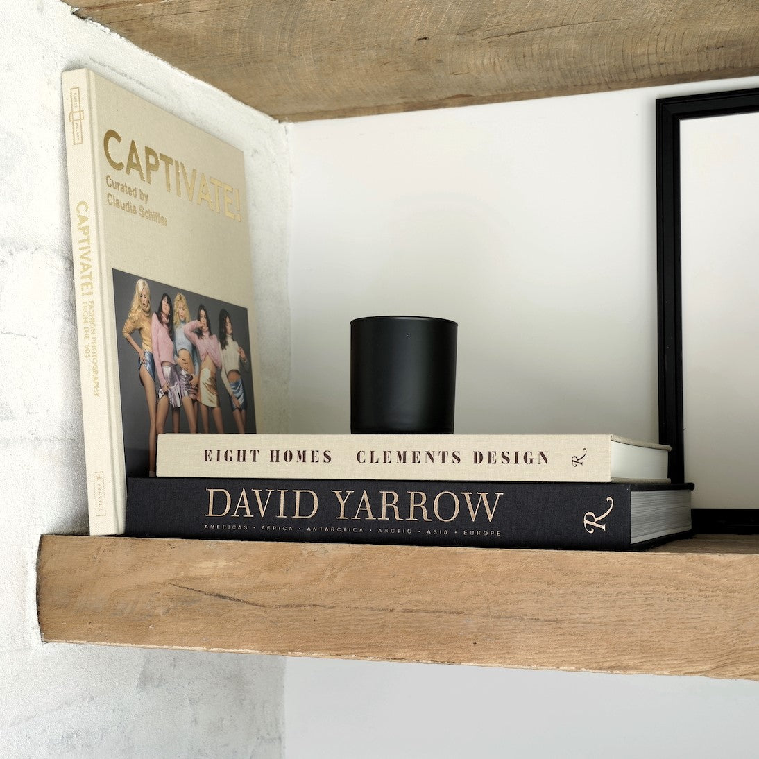 Eight Homes Clements Design-Kathleen and Tommy Clements Interior Design-Introduction by Mayer Rus-Published by Rizzoli-Hardcover Coffee Table Book-Flat Side Spine Angled Display on Book Shelf with Captivate! and David Yarrow Books