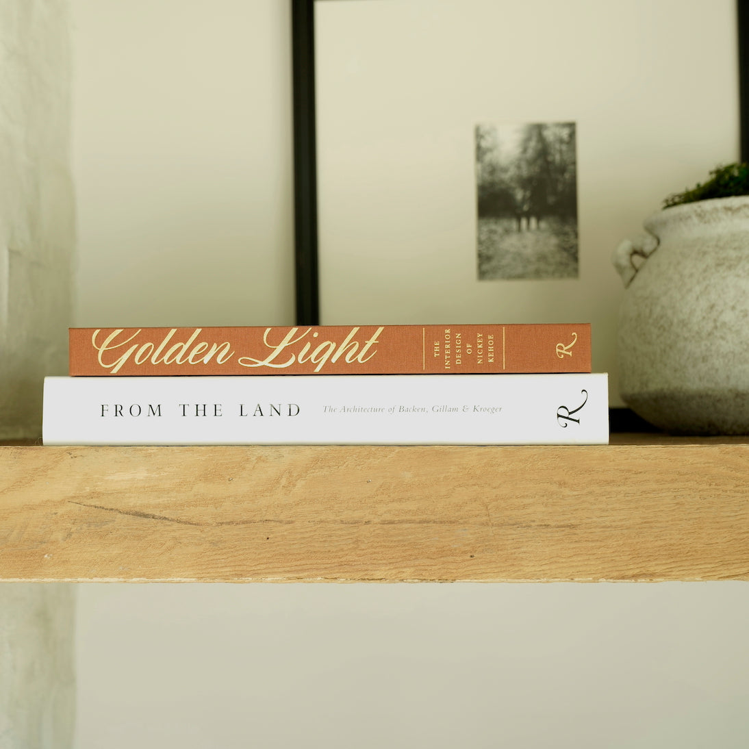 From The Land-The Architecture of Backen, Gillam & Kroeger-by Daniel P. Gregory, foreword by Diane Keaton, published by Rizzoli-Hardcover Coffee Table Book-Black and White-Side Spine Display on Book Shelf with Golden Light and Savina Vase